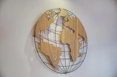 a wooden world globe hanging on a wall at Fil - Piscine - 2 min Mer - VCA in Cannes