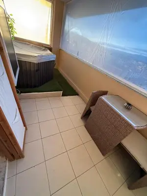 a bathroom with a sink and a bench and a window at Azuria in Cannes