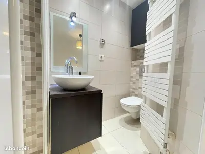 a bathroom with a sink and a toilet at Lovely Flat with Covered Balcony in Cannes in Cannes