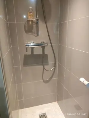 a shower with a hose in a bathroom at Chante Brise 2 Pieces in Cannes