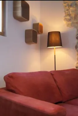 a living room with a couch and a lamp at Chante Brise 2 Pieces in Cannes