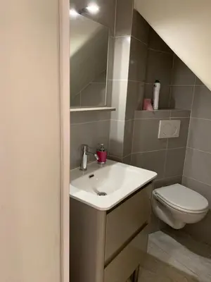 a bathroom with a sink and a toilet at Chante Brise Studio in Cannes