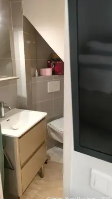 a bathroom with a sink and a toilet at Chante Brise Studio in Cannes