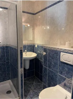 a bathroom with a sink and a toilet and a shower at studio standing cannes croisette in Cannes