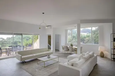 a living room with a couch and a table at La Villa Julia Two in Vallauris