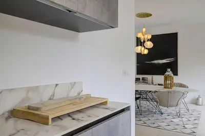 a kitchen with a bench on top of a counter at Villa Julia First in Vallauris