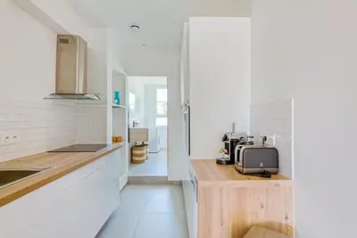 a kitchen with a counter with a microwave on it at LE VOILIER avec terrasse panoramique vue mer et port, proche du Palais, Croisette et plages in Cannes
