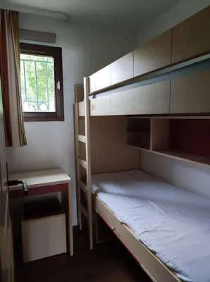 a bedroom with two bunk beds and a window at Cannes Villa Francia appartement climatisé vue mer in Cannes