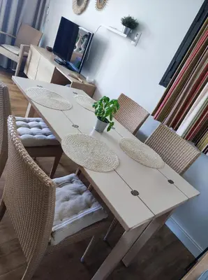 a white table with chairs and a potted plant on it at Cannes Villa Francia appartement climatisé vue mer in Cannes