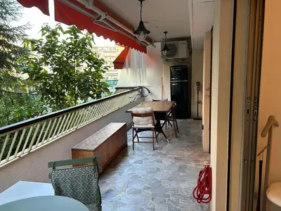 a balcony with a table and chairs on it at Appartement T2 bord de mer in Cannes