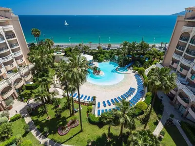 an aerial view of a resort with a pool and the ocean at Appartement 4 personnes sea view pool in Cannes