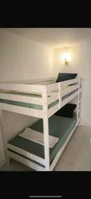 a white bunk bed in a room at Appartement 4 personnes sea view pool in Cannes