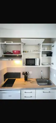 a kitchen with a sink and a counter top at Appartement 4 personnes sea view pool in Cannes