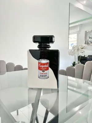 a bottle of sauce sitting on top of a glass table at Gray D'Albion -2A8- 1 Chambre in Cannes