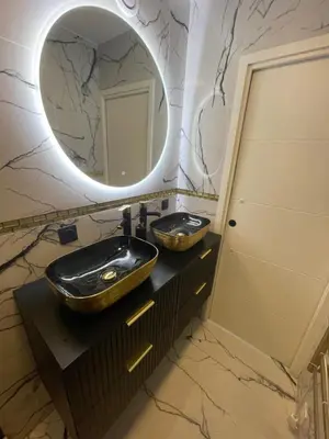 a bathroom with two sinks and a mirror at Cannes Appartement Terrasse Parking privé in Cannes