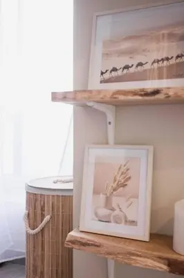 a picture on a wooden shelf with a picture of animals at Kaméa - Palais & plage, clim, vieux Suquet, port in Cannes