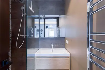 a bathroom with a sink and a mirror at Studio Charlie - Bd de Lorraine in Cannes