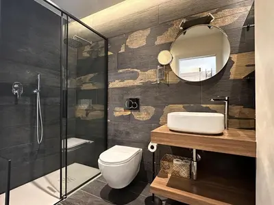 a bathroom with a shower and a toilet and a mirror at Modern studio in the hearth of Cannes just a few steps from the Croisette beach front and shops - 2242 in Cannes