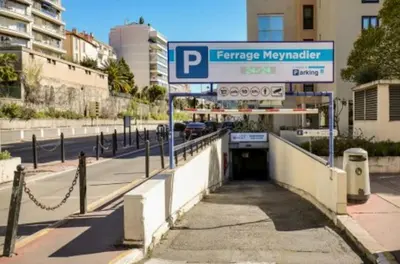 a street sign in front of a parking garage at 3 ROOMS - DOWNTOWN CANNES - 2 MIN FROM PALAIS Festivals in Cannes