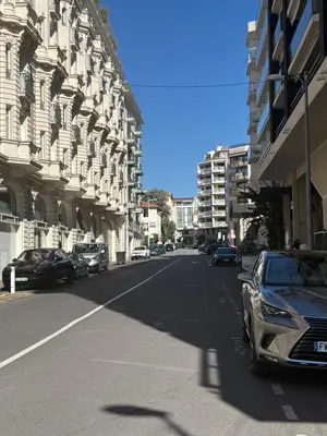 a street with cars parked on the side of a building at Appartement terrasse Croisette in Cannes