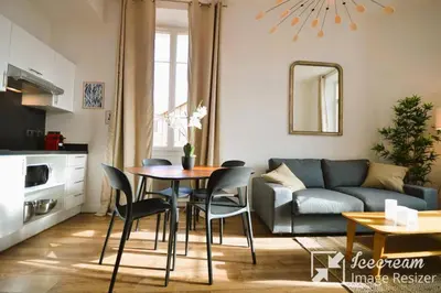 a living room with a table and chairs and a couch at 
