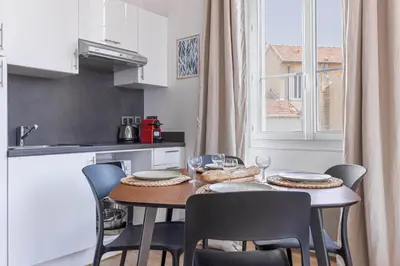 a kitchen with a table and chairs in a kitchen at 