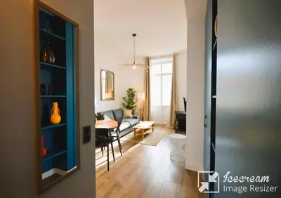 a living room with a couch and a table at 