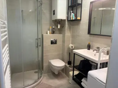 a bathroom with a shower and a toilet and a sink at studio Pointe Croisette avec terrasse in Cannes