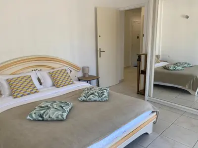two pillows on a bed in a bedroom at Charming apartment in the centre of Cannes in Cannes