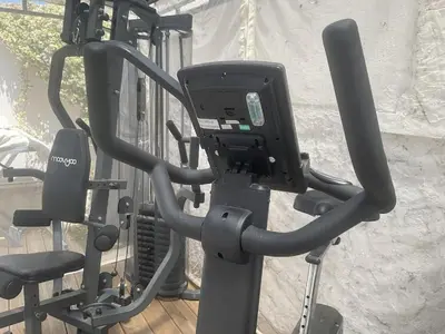 a gym with a machine and a chair at Villa 12MN Walk from le palais in Cannes
