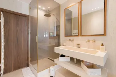a bathroom with a sink and a shower at La Réale Croisette in Cannes