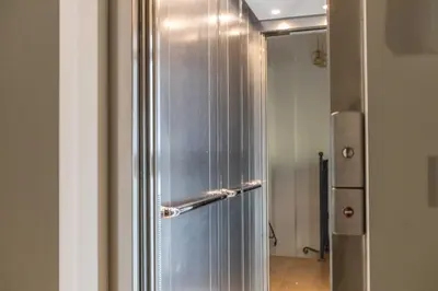 a stainless steel refrigerator is in a room at LB Vacation Rentals I Superieure Room 22m2 - Spacious I Casa d'Azur in Cannes