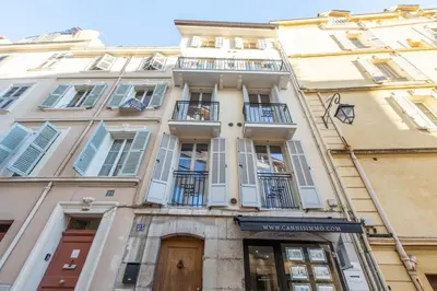 a tall white building with balconies on it at LB Vacation Rentals I Superieure Room 22m2 - Spacious I Casa d'Azur in Cannes
