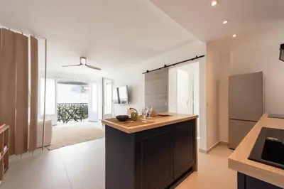 a kitchen with a large island in the middle at Bright 1-Br Apartment Walk to the Beach in Cannes