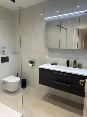 a bathroom with a toilet and a sink and a shower at Golden House Cannes in Cannes