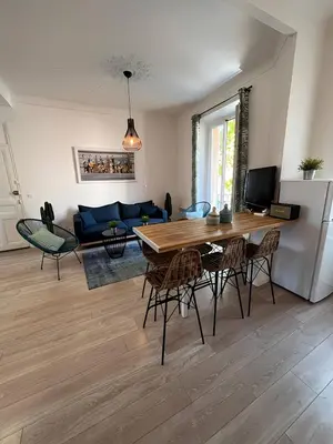 a bedroom with a large bed and a desk at FRGK 