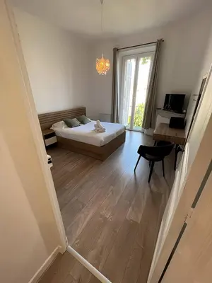 a hallway with a door leading to a living room at FRGK 