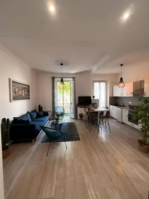 a white room with a staircase and a table at FRGK 
