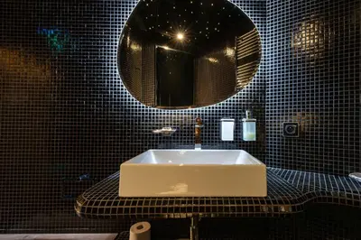 a bathroom with a sink and a mirror at RARE! 2-Br with Pools Beach Access Private Parking in Cannes