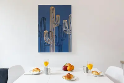 a white table with plates of food on it at L'Elégant YourHostHelper in Cannes