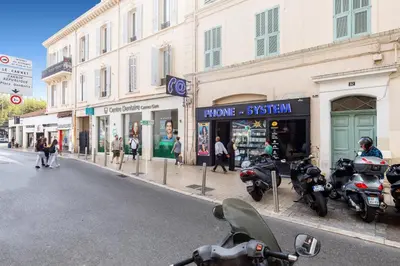 a group of motorcycles parked on the side of a street at L'Elégant YourHostHelper in Cannes