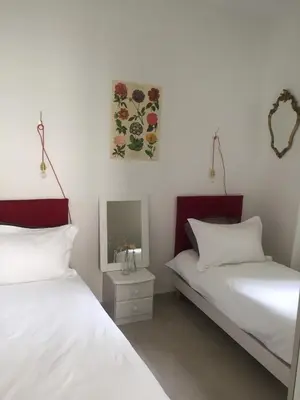 a bedroom with two beds and a tv on the wall at Cannes congrès in Cannes