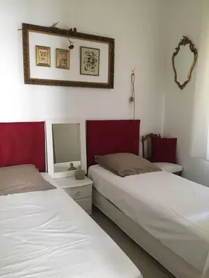 a bedroom with two beds and a mirror at Cannes congrès in Cannes