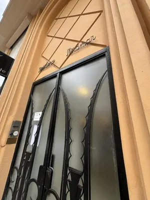 a window on the side of a building at Apt moderne et luxueux a Cannes Res Miramar in Cannes