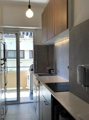 a kitchen with a sink and a counter top at T2 Appartement 55m2 Terrasse 20m2 - à 15min à pied du Centre Ville - Wifi - Air conditioning in Cannes