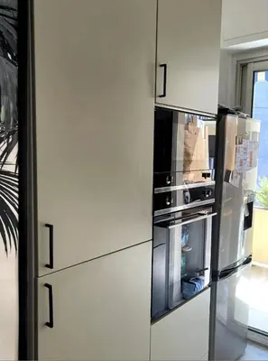 a refrigerator with its door open in a kitchen at T2 Appartement 55m2 Terrasse 20m2 - à 15min à pied du Centre Ville - Wifi - Air conditioning in Cannes