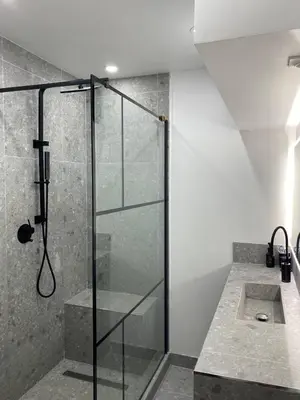 a glass shower in a bathroom with a sink at T2 Appartement 55m2 Terrasse 20m2 - à 15min à pied du Centre Ville - Wifi - Air conditioning in Cannes