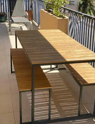 two wooden tables sitting on top of a balcony at T2 Appartement 55m2 Terrasse 20m2 - à 15min à pied du Centre Ville - Wifi - Air conditioning in Cannes