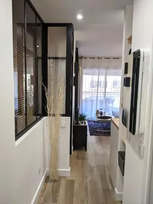 a room with a hallway with a vase on the floor at Centre Cannes 2-Bed Apt & garage 5min Croisette in Cannes