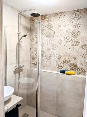a bathroom with a shower and a sink at Centre Cannes 2-Bed Apt & garage 5min Croisette in Cannes